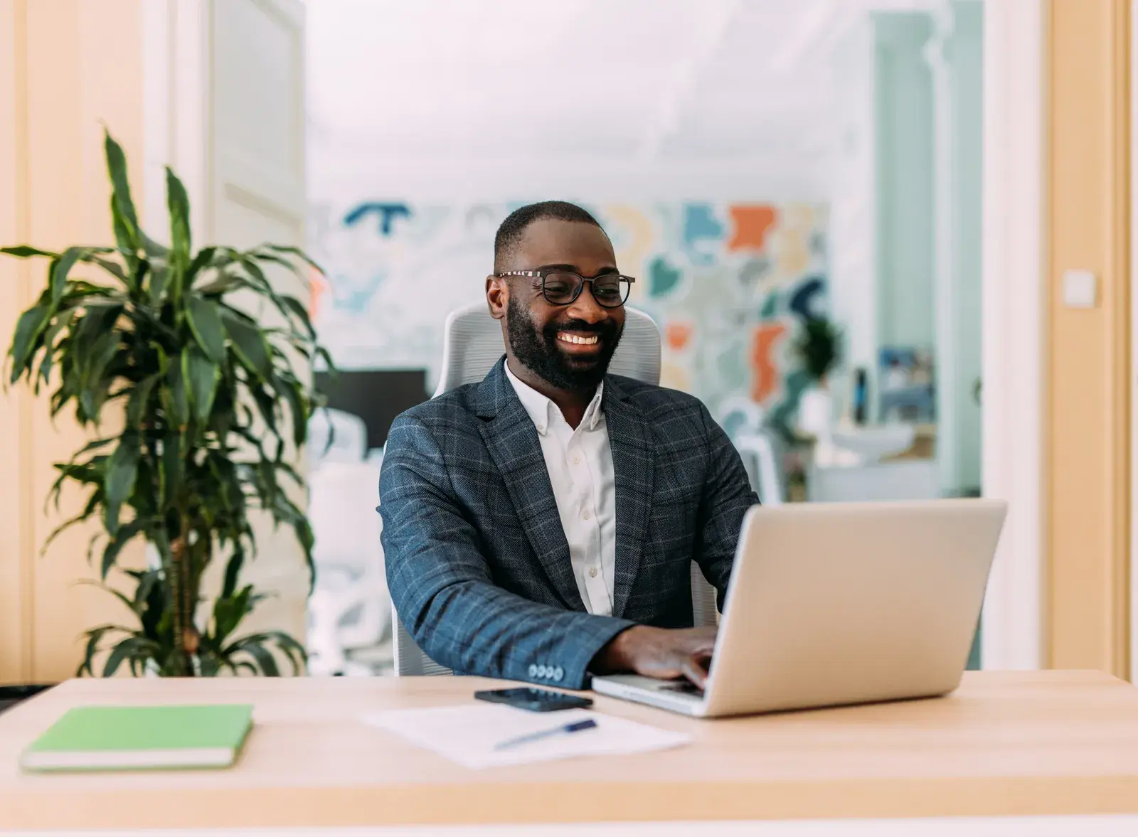 Business owner working on a laptop in his office